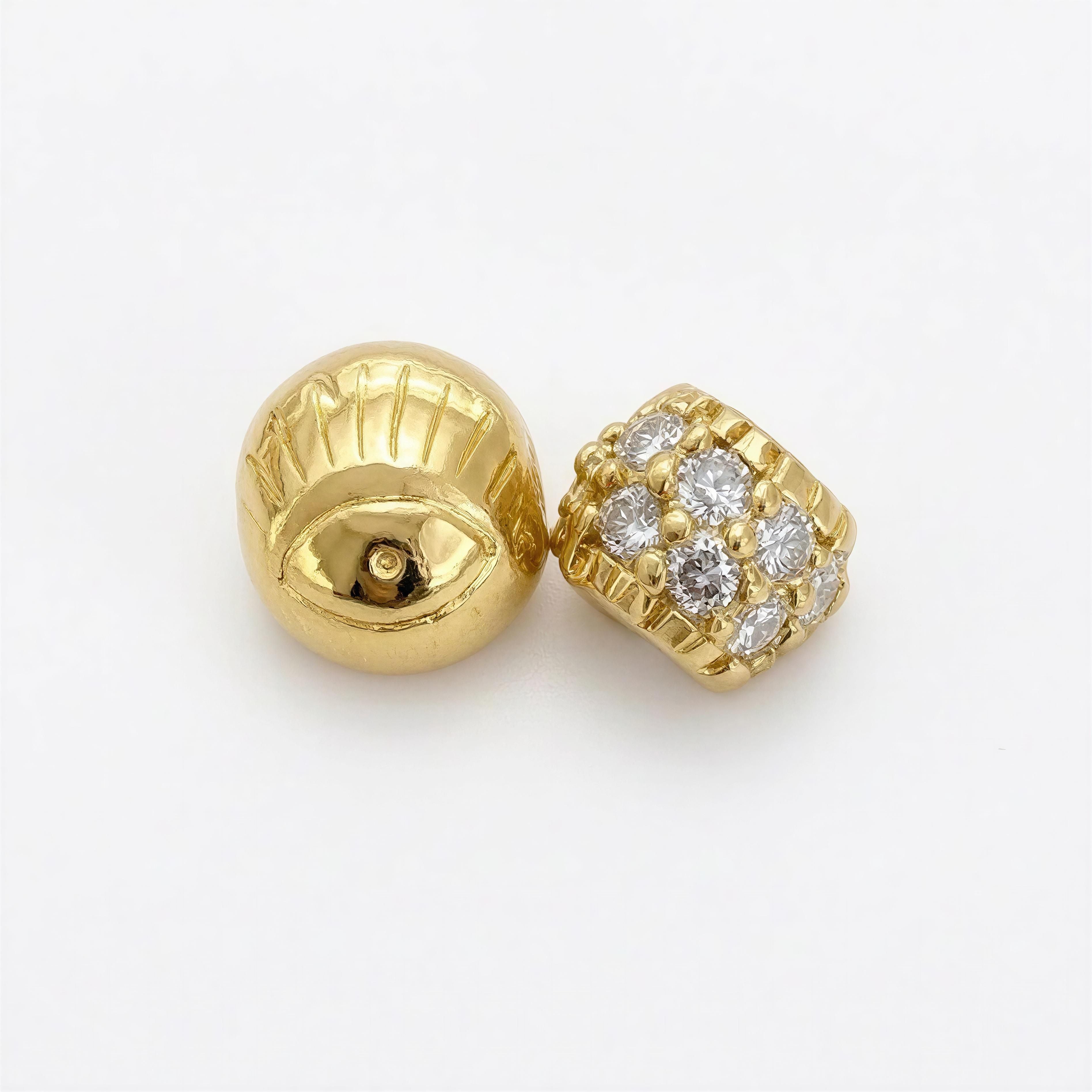Pair of gold beads from XX Elégance- Golden Vision, featuring a textured eye design and a cluster of sparkling clear stones for a handcrafted luxury jewelry look.