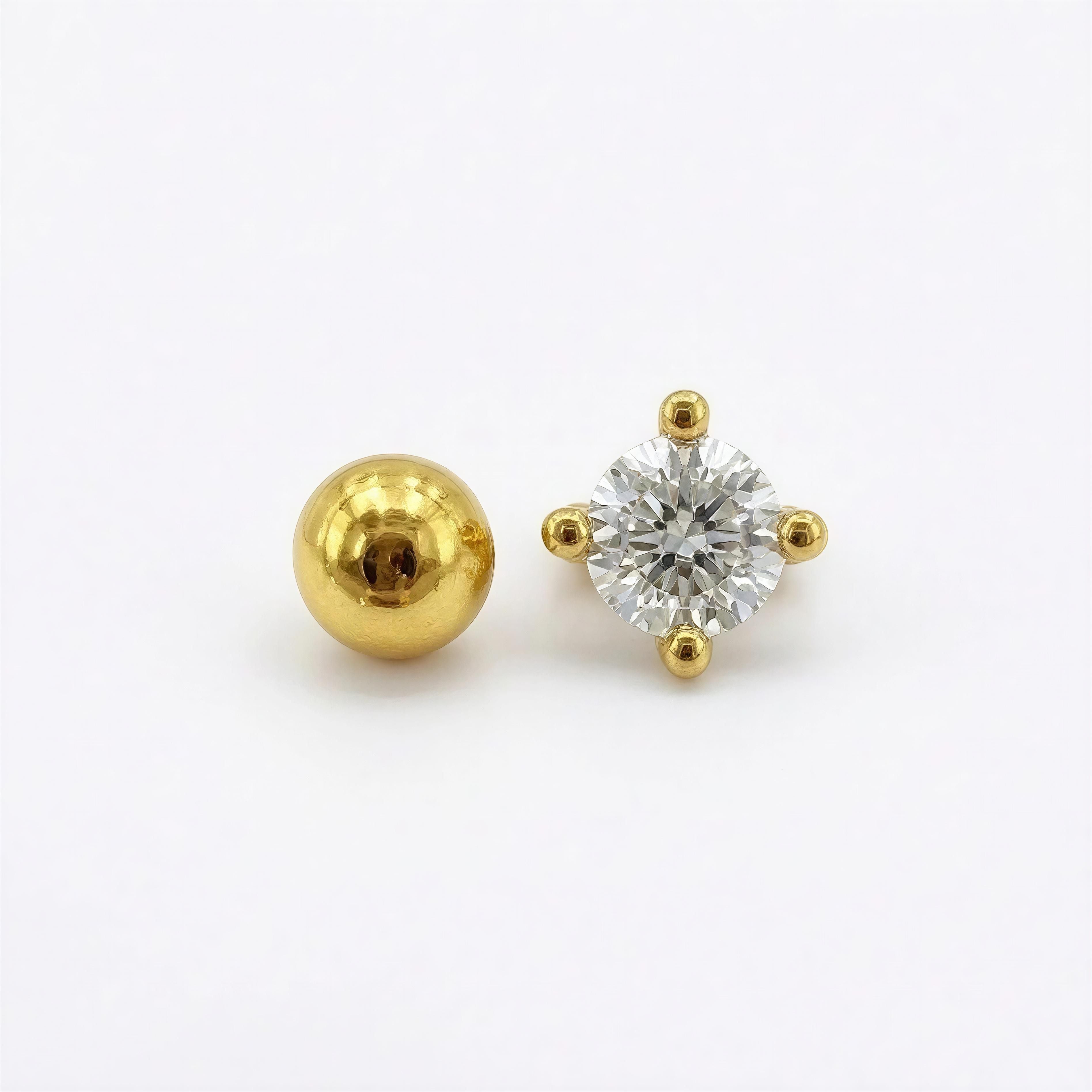 RING - LUCENT ÉTOILE RING featuring a brilliant round-cut clear stone set in four gold prongs beside a polished gold spherical bead, showcasing handcrafted luxury jewelry.