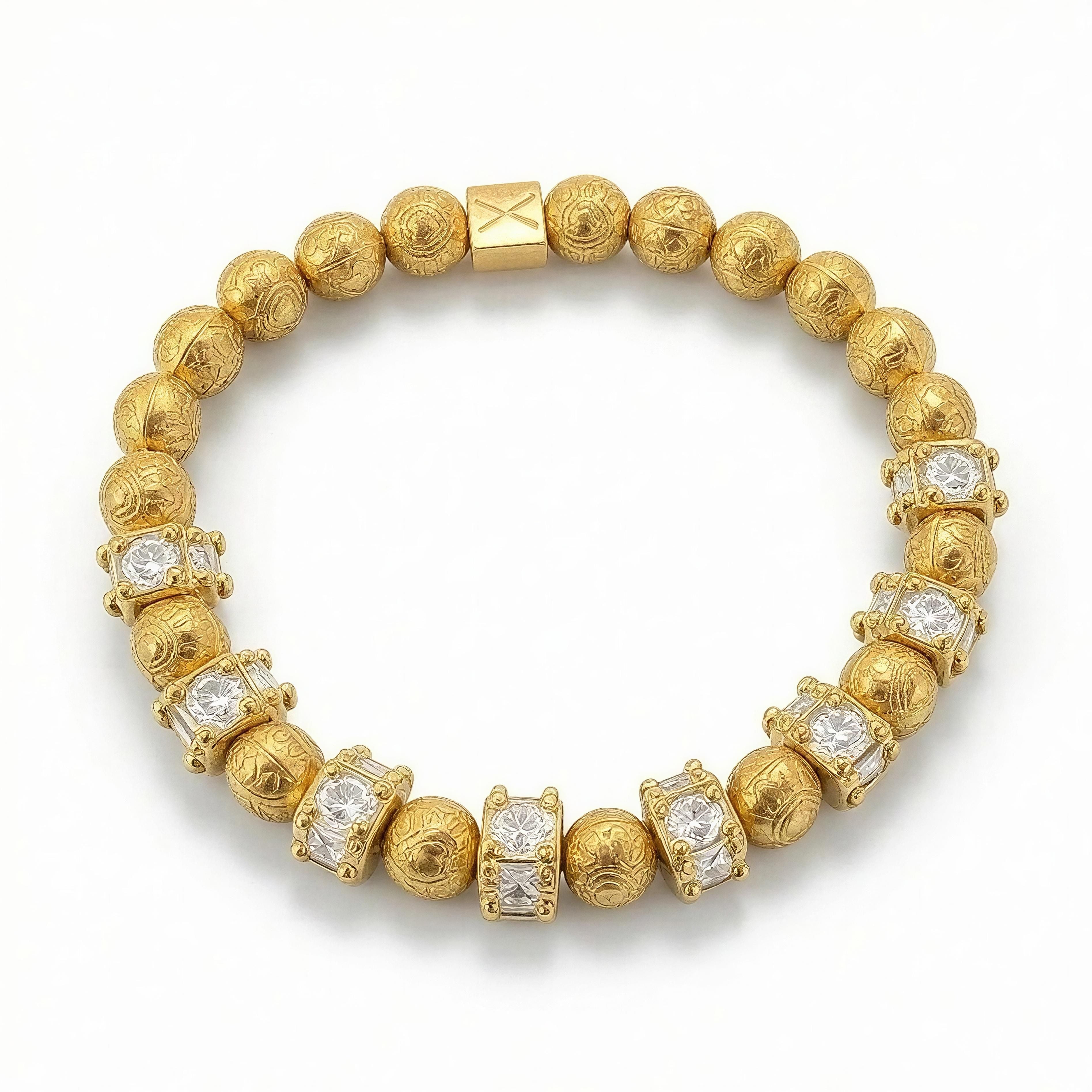 LIMITED EDITION - Golden Aura bracelet featuring intricately engraved gold beads and sparkling crystal accents, showcasing handcrafted luxury jewelry by Atelier X.