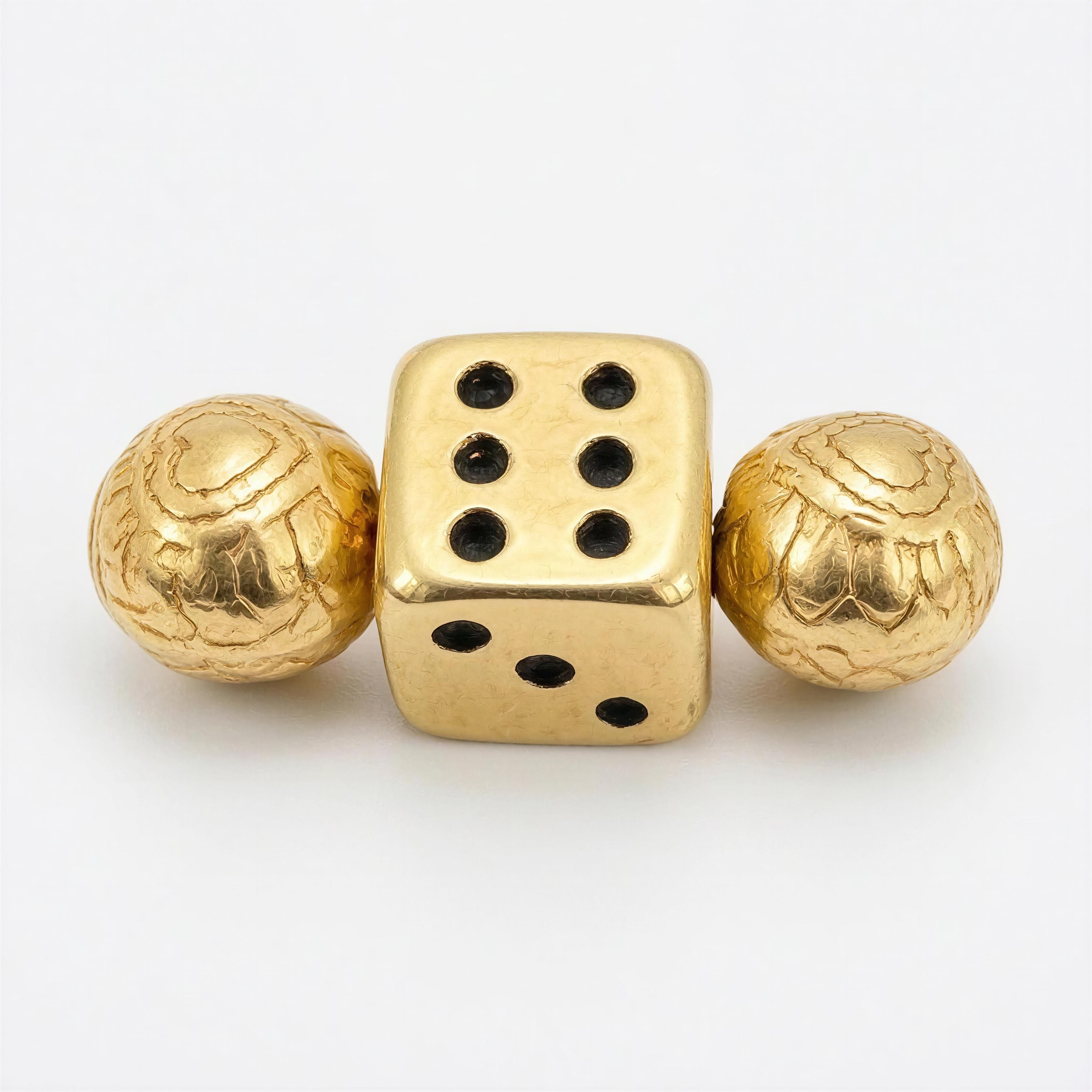 Close-up of a handcrafted gold bead and dice charm featuring intricate details, part of the Limited Edition - Alea Aurea Lux luxury jewelry collection.